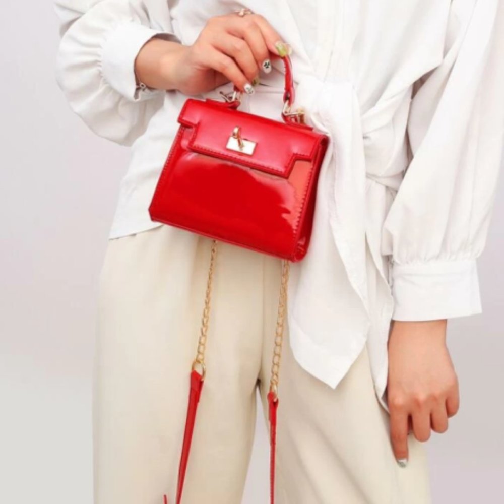 Red mini PU leather bag with gold twist-close lock